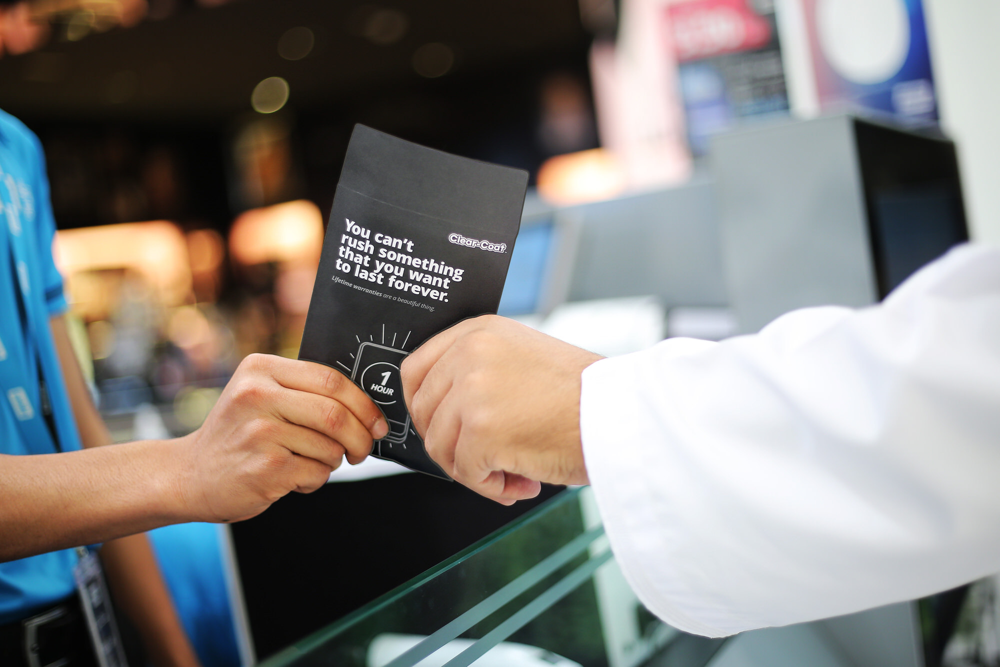 Mobile Outfitters lifetime warranty card presented at a store